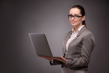 Young businesswoman working with laptop in business concept