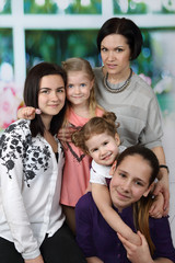 Mother with four daughters portrait - Big family and parenting concept
