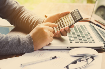 Working on a desk numerical analysis, financial accounting. Graphing