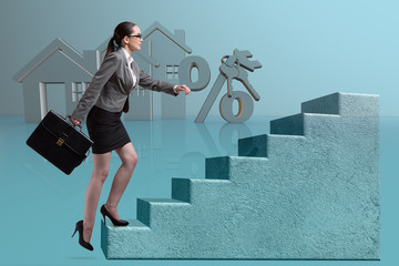 Businesswoman walking climbing stairs in mortgage