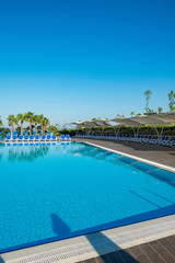 Nice swimming pool outdoors on bright summer day