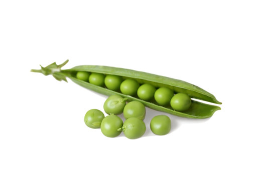 Pods of green peas close up isolated on white background with shadow