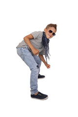 Teenage boy in sunglasses posing isolated on white background