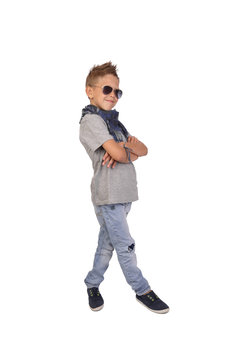 Teenage boy in sunglasses posing isolated on white background