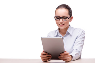 Businesswoman working on tablet computer on white background