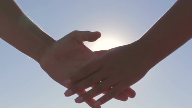 Couple on a date holding hands solar flare