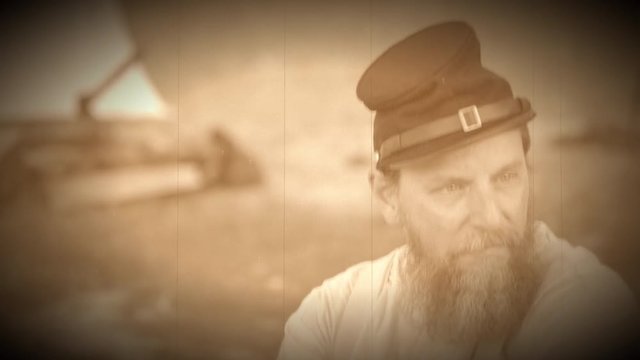 Civil War soldier sitting alone in camp (Archive Footage Version)