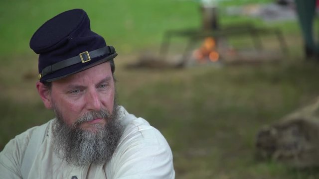 Civil War soldier sits away from camp