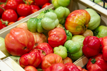 Red group of tomatoes with green insertion