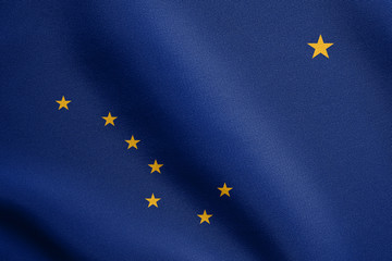 Flag of Alaska waving with fabric texture