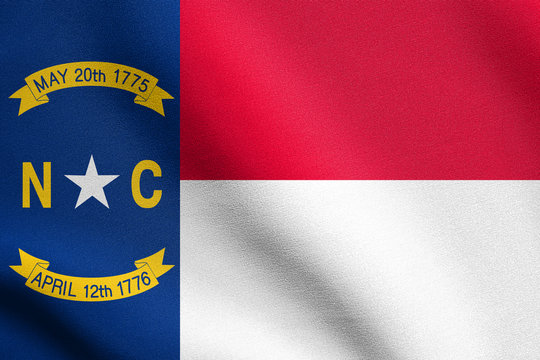 Flag of North Carolina waving with fabric texture