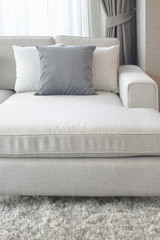 Beige couch with pillows in living room, so comfortable