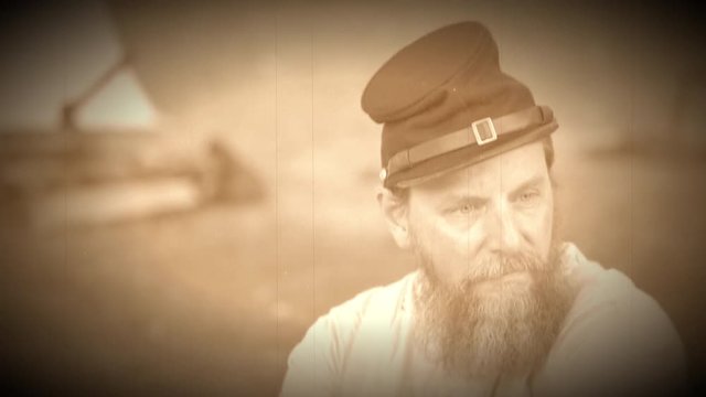Civil War soldier sits near camp (Archive Footage Version)