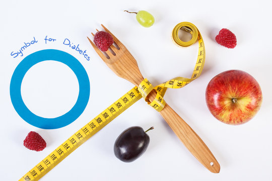 Symbol of world diabetes day and fresh fruits with centimeter