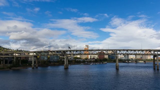4k uhd time lapse movie of moving clouds and auto traffic on Marquam bridge along Willamette River waterfront in scenic downtown Portland Oregon 4096x2304