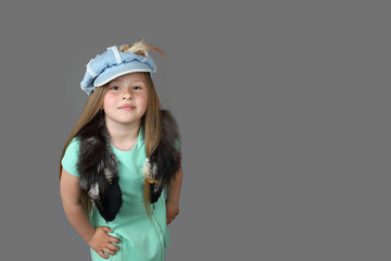 Naklejka premium Cute little model girl posing isolated on dark gray background with copy space/place for text message - Children fashion and beauty concept