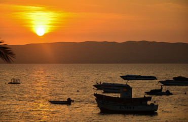 Fishing boats at sunset in Paracas, Peru