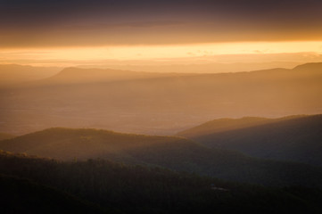 Naklejka na ściany i meble Colorful spring sunset over the Blue Ridge Mountains, seen from