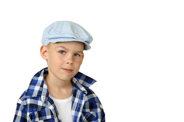 Stylish boy in plaid shirt and cap closeup portrait isolated on white background with copy space for text or advertising