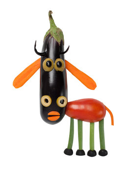 Funny cow made of vegetables on isolated background