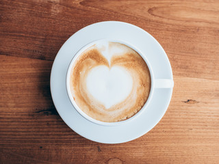top view cup and coffee on wooden table