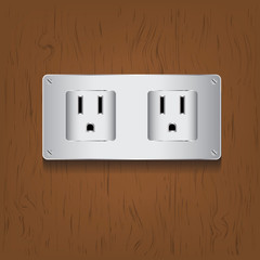 Electric plug on wood background