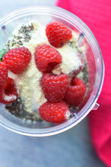 raspberries protein powder and chia seeds smoothie ingredients