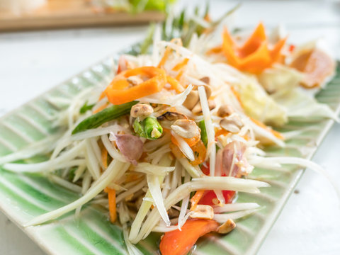 Papaya salad or Som tum, Thai food on table