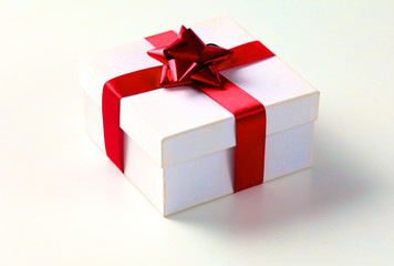 New Year gift on a golden tinsel background boly