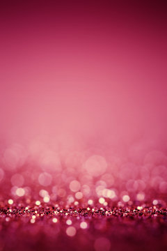 Abstract Blurred pink background with glitter sparkle bokeh.