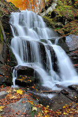 Fototapeta na wymiar Autumn forest waterfall