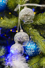 Christmas decorations on artificial fir.