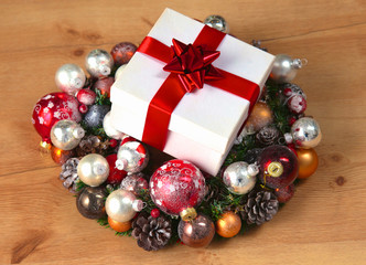 New Year gift on a golden tinsel background boly