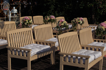 The benches with decorations for wedding ceremony