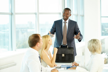Businessman explaining something to his colleagues