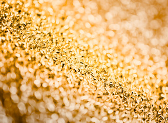 Gold defocused glitter background with copy space