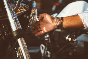 Man touching moto headlight
