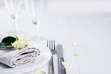 Served plate with napkin and rose close-up