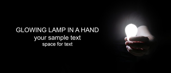 man in dark with glow bulb