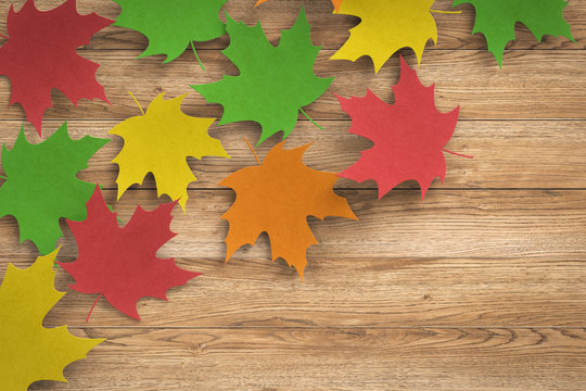 thanksgiving day concept with 3d rendered colourful maples on wooden background