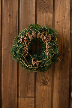 christmas pine wreath on wooden surface