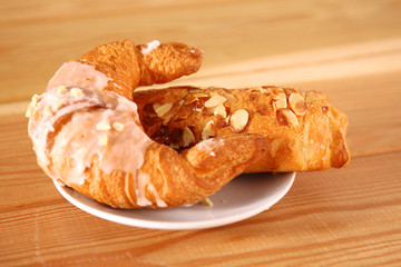 Croissant in the plate on the table