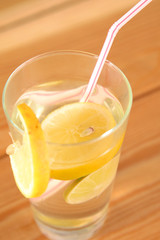 lemonade in a glass on wooden table