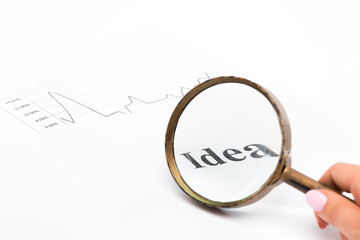 Magnifying glass on Idea text paper