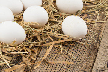 Eggs on wooden background.