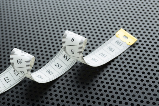 Curved white measuring tape