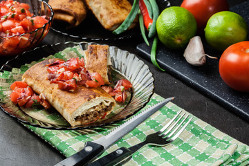 Mexican chimichanga with salsa dip