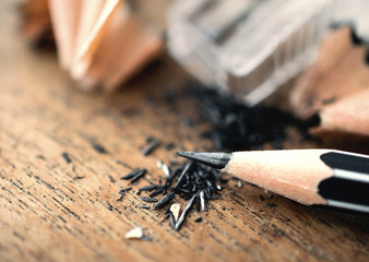 pencil with sharpening shavings, on wooden table.. - obrazy, fototapety, plakaty