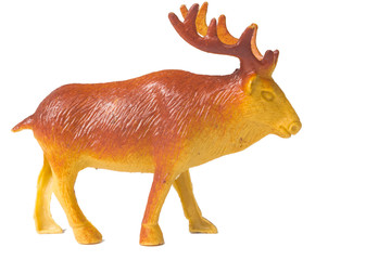 Toy deer made of plastic on a white background
