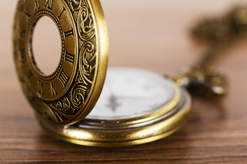 Pocket watch against a rustic background